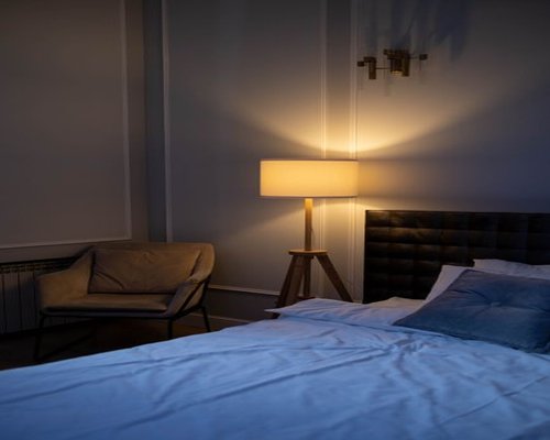 Cozy bedroom with comfortable pillows prepared for a good night sleep